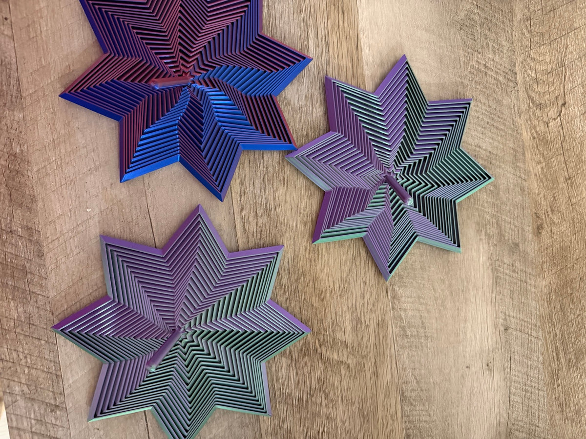 Three colorful star fidgets
